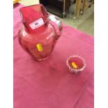 A Victorian cranberry glass jug and a cranberry glass salt