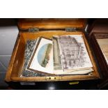 A Victorian wooden box of postcards