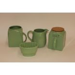 Two Pountney Bristol Kitchenware storage jars; a matching jelly mould; and a milk jug (chipped) (4)