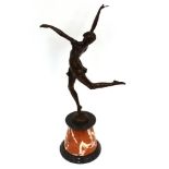 An Art Deco design bronze figure of a dancer, raised on red and black marble plinth, 68cm