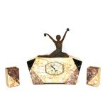 An Art Deco marble clock garniture, the clock surmounted by a Spelter figure of a female gymnast