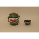 A Maling ware azalea pattern biscuit barrel, with wicker handle; and a Maling ware bowl