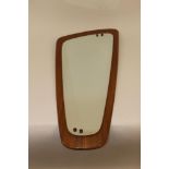 A 1970's teak framed wall mirror