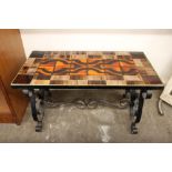 A 1960's wrought metal tile topped table, 80cm