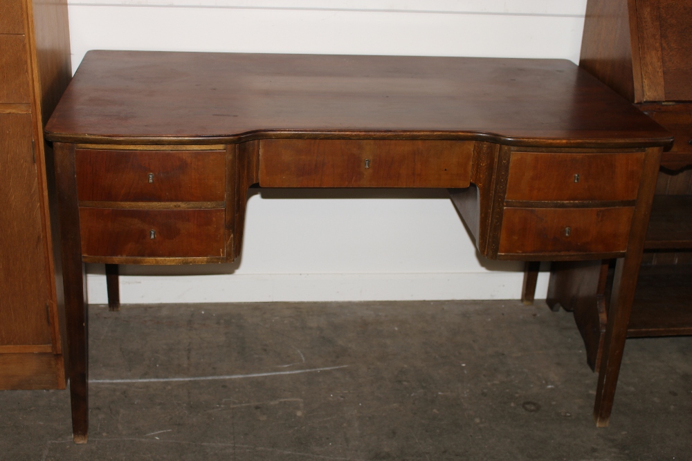 A 1930's Danish walnut kneehole writing desk fitted five drawers, raised on square section supports,