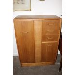 A 1950's oak gentleman's wardrobe, fitted angular handles, 89cm wide x 122cm high