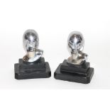 A pair of Metropolis Machine Age chrome bookends, 13cm high