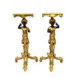 A pair of gilded Blackamoor jardinière stands, 84cm high x 33cm wide