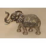 A silvered model of an elephant, 73cm long