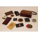 A collection of items to include a tooled leather evening bag; four purses; vintage powder