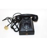 A black Bakelite telephone