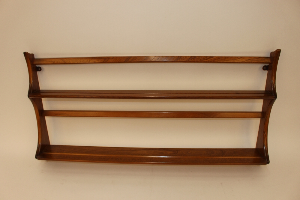 A light Ercol plate rack, 96cm