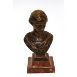 An early 20th Century bronze bust of a young woman raised on a marble plinth, 29cm high