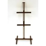 A small brass adjustable easel photograph stand, 66cm high
