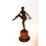 An Art Deco style bronzed figure after Alonzo, depicting a semi naked dancing hoop girl raised on