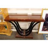 An Art Deco style console table, raised on bowed ebonised reports 120cm wide