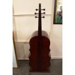 An unusual four drawer chest, in the form of an upright cello, 160cm high x 53cm wide in extremes