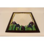 An Art Deco style stained glass overlaid wall mirror, with floral decoration and contained in a