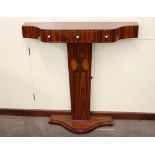 An Art Deco design three drawer serpentine fronted console table, raised on an inlaid plinth and