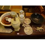 A pottery bowl; various cherub ornaments; a table