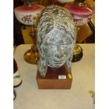 A plaster bust in the form of a female head