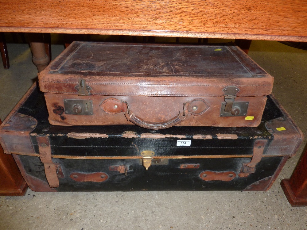 A leather and canvas suitcase; and a brown leather