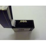 An 18ct gold three stone diamond set ring