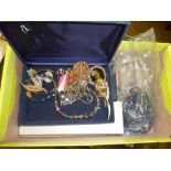 A box of various costume jewellery