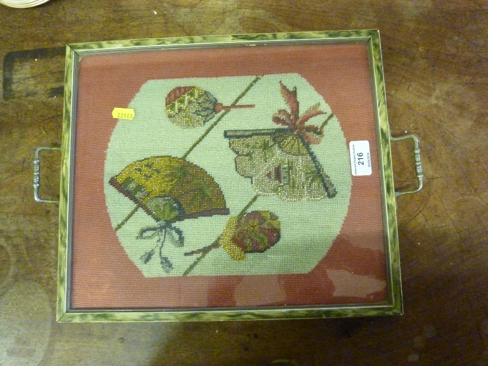 A two handled tray inset with a Victorian beadwork