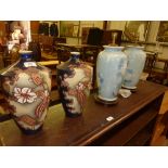 A pair of floral decorated vases and two floral de