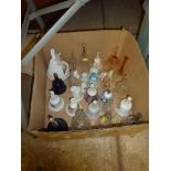 A box of various hand bells