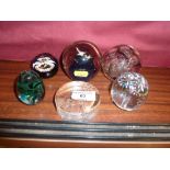 A Caithness glass paperweight and five other paper