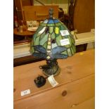 A Tiffany style table lamp and shade