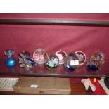 Eleven various glass paperweights