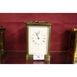 A brass cased carriage clock, the dial signed Henr