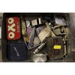 A tin containing whistles; lighters; penknives etc