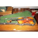 A violin and bow in fitted case