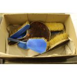 A silver and tortoiseshell dressing table set; and