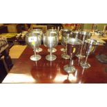 A quantity of pewter and silver plated goblets