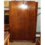 A 1920's oak two door wardrobe