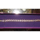 A silver gilt and purple stone set bracelet and tw