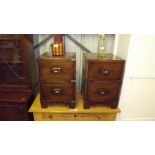 A pair of mahogany campaign style two drawer bedsi