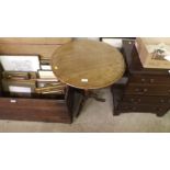 A mahogany circular top tripod table