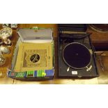 A table top gramophone; and a box of records