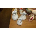 A set of three Victorian Parian ware jugs