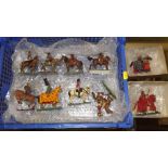 A box containing ten painted metal model knights o