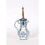 A Delft style blue and white lidded baluster jug, with plated mount, beast head spout, and