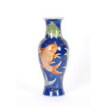 A Chinese porcelain baluster vase, decorated fish on a blue ground, heightened in gilt, 37cm high