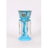 A Victorian blue opaque glass and enamel decorated lustre vase, hung with spike shape prism drops,