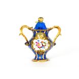 A Rockingham type baluster potpourri vase, the cover with floral finial, central painted cartouche